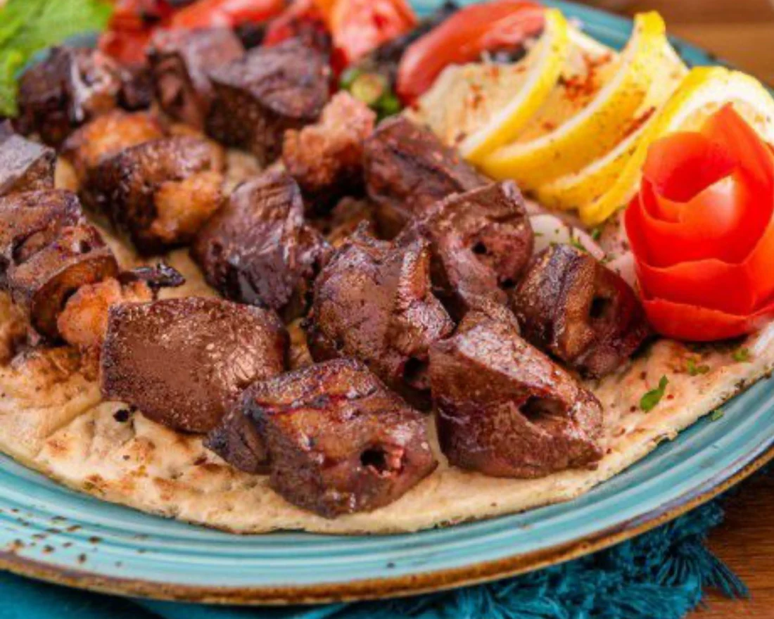Charcoal grilled halal lamb skewers with rice and salad at Donya Kebab Middle Eastern restaurant in London, Ontario